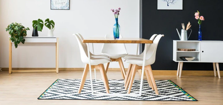 Cuál es la distancia correcta para colocar una alfombra debajo de una mesa de comedor?